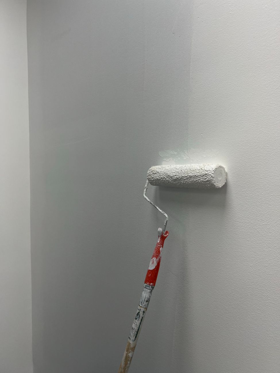 fresh white paint applied on indoor wall